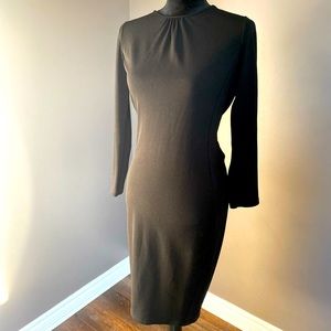 Open back below the knee beautiful classy black dress with sleeves.